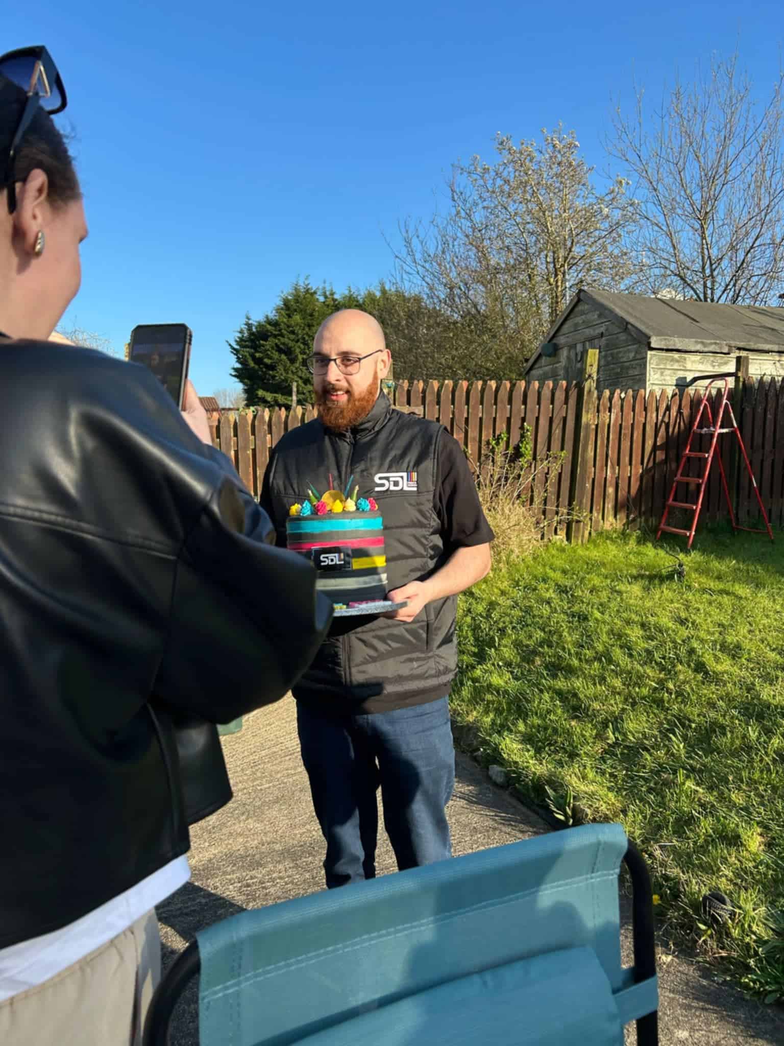 Luke Cheevers with an SDL Creative cake